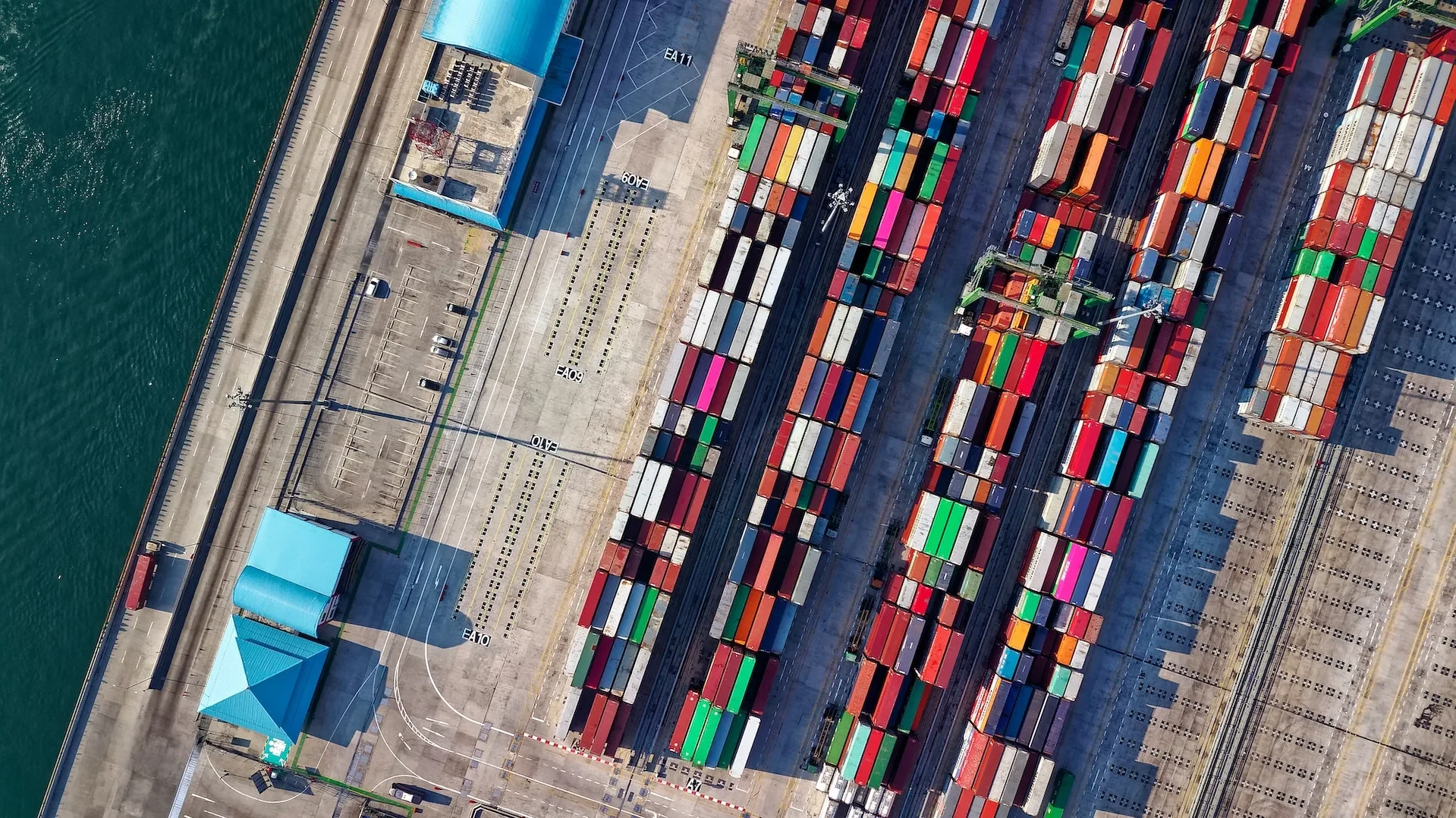 Shipping containers arranged in a connected port system.
