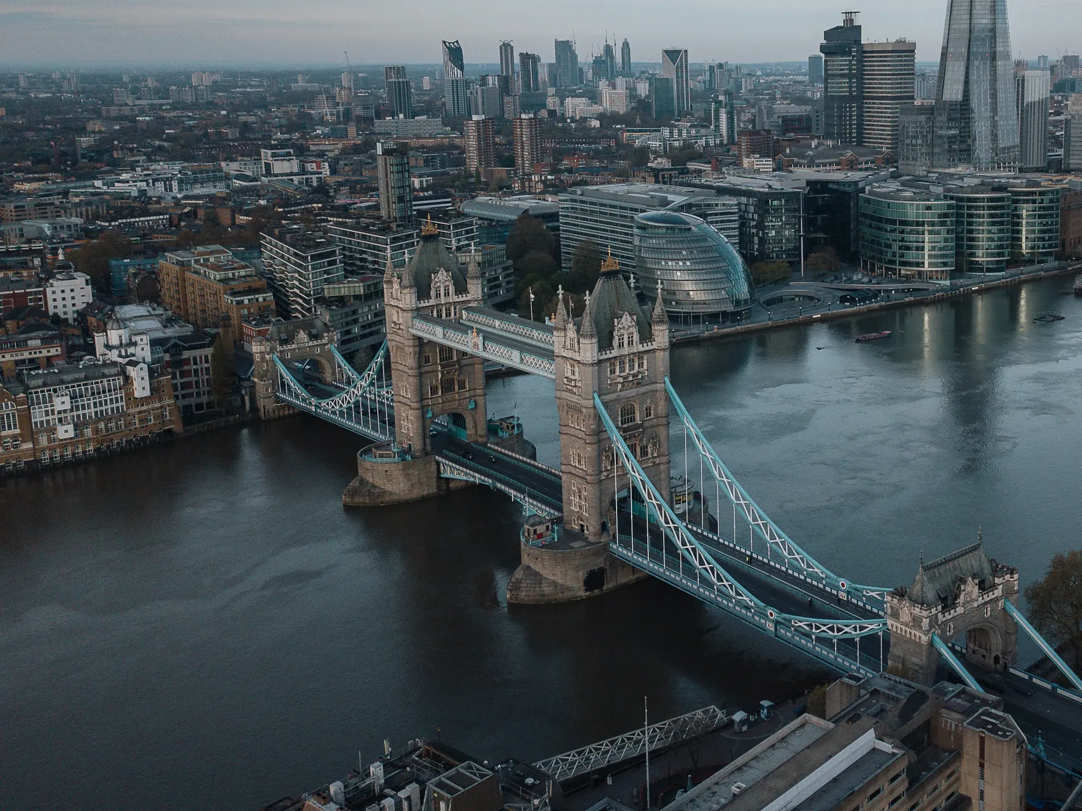 Tower Bridge and the London skyline from above.